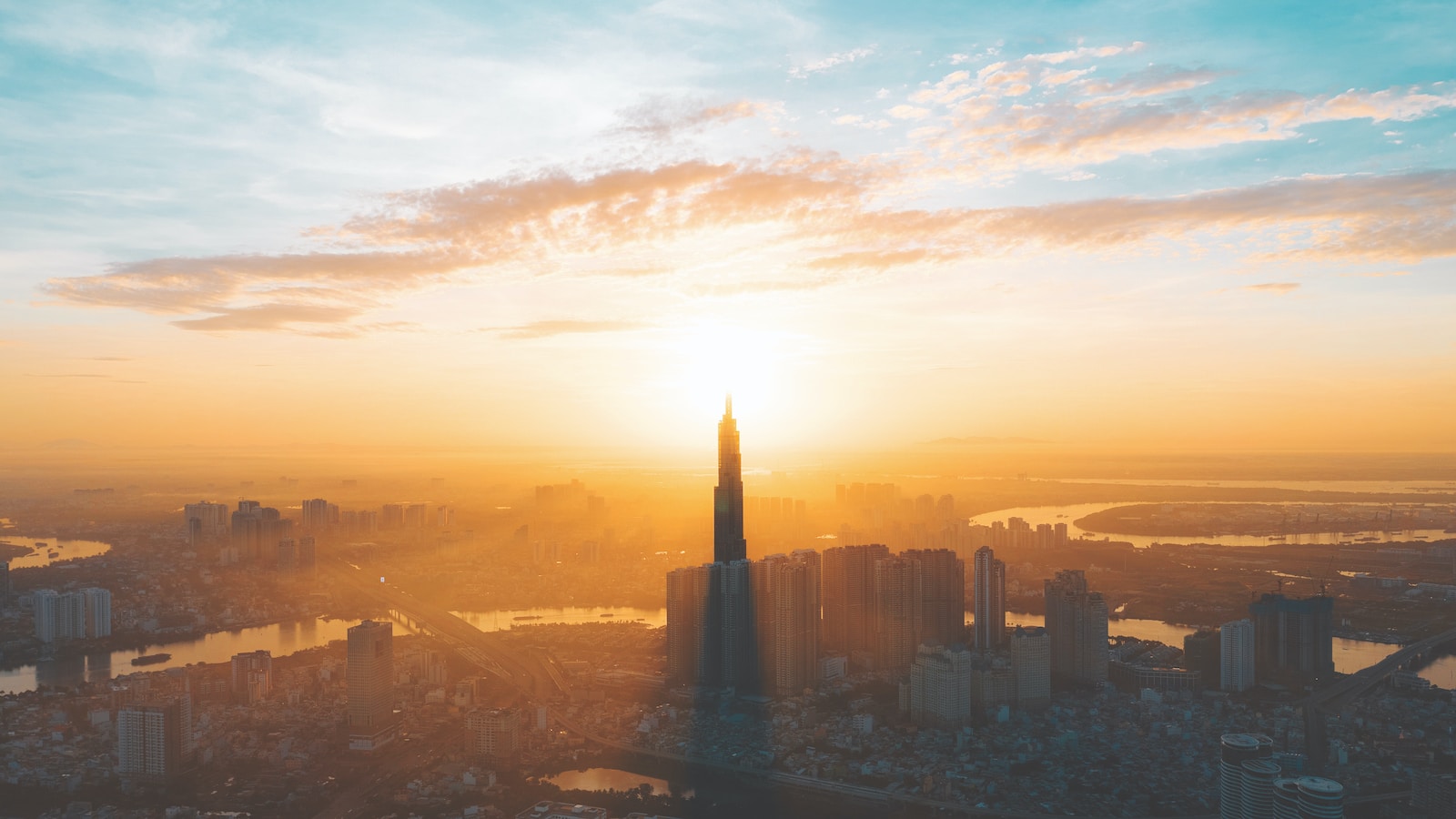 city skyline during sunset with cloudy sky